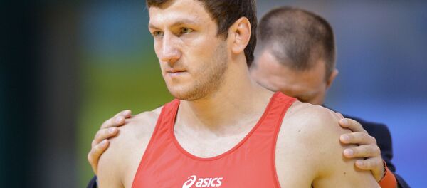 Денис Царгуш перед началом поединка 1/8 финала мужского турнира по вольной борьбе. Денис Царгуш перед началом поединка 1/8 финала мужского турнира по вольной борьбе. - Sputnik Абхазия