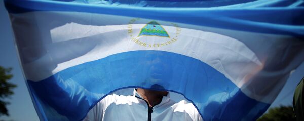 Флаг Республики Никарагуа. Архивное фото. Флаг Республики Никарагуа. Архивное фото. - Sputnik Абхазия