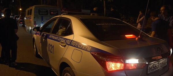 Машина МВД на месте убийства Виталия Асландзия. Фото с места события - Sputnik Абхазия