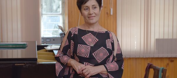 акопелла амузыкатә напхгаҩы, адирижиор хада Нора Аџьынџьалԥҳа. акопелла амузыкатә напхгаҩы, адирижиор хада Нора Аџьынџьалԥҳа. - Sputnik Аҧсны