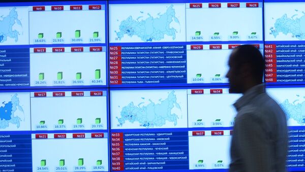 Информационные экраны в Центральной избирательной комиссии в единый день голосования. - Sputnik Абхазия