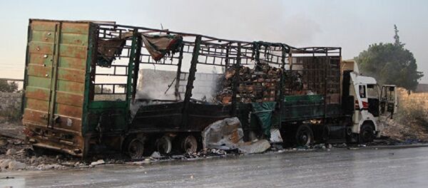 Сгоревший грузовик гумконвоя ООН в Алеппо Сгоревший грузовик гумконвоя ООН в Алеппо - Sputnik Абхазия