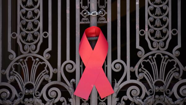 Красная лента — символ борьбы со СПИДом - Sputnik Абхазия