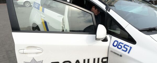 Сотрудник украинской полиции в Киеве Сотрудник украинской полиции в Киеве - Sputnik Абхазия
