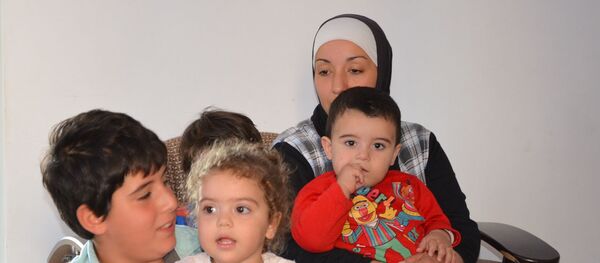 Семья репатриантов в поселке Агудзера Семья репатриантов в поселке Агудзера - Sputnik Абхазия