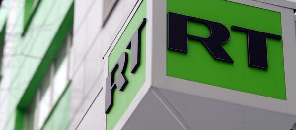 Логотип телеканала Russia Today на здании в Москве - Sputnik Аҧсны