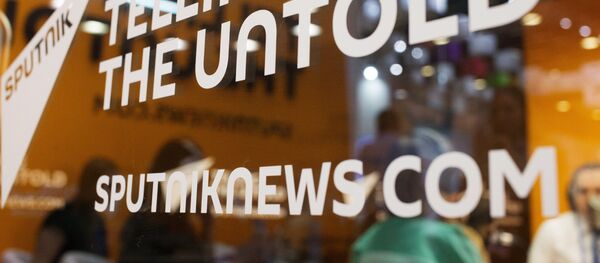 Слоган Telling the untold на студии международного информационного агентства и радио Sputnik. Слоган Telling the untold на студии международного информационного агентства и радио Sputnik. - Sputnik Аҧсны