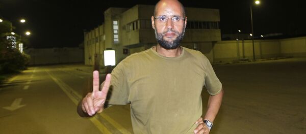 Саиф аль-Ислам Каддафи, сын ливийского лидера Муамара Каддафи, перед журналистами в жилом комплексе своего отца (23 августа 2011). Триполи, Ливия Саиф аль-Ислам Каддафи, сын ливийского лидера Муамара Каддафи, перед журналистами в жилом комплексе своего отца (23 августа 2011). Триполи, Ливия - Sputnik Абхазия