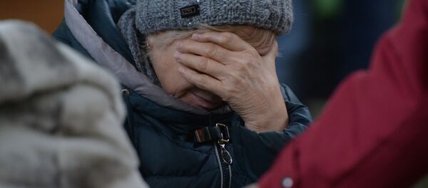 Родственница одного из пропавших без вести при пожаре в торговом центре «Зимняя вишня» в Кемерово Родственница одного из пропавших без вести при пожаре в торговом центре «Зимняя вишня» в Кемерово - Sputnik Абхазия