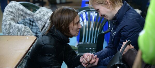 Родственники одного из пропавших без вести при пожаре в торговом центре «Зимняя вишня» в Кемерово - Sputnik Абхазия