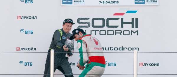 Дмитрий Гвазава отмечает победу в гонке Mitjet Winter Cup Дмитрий Гвазава отмечает победу в гонке Mitjet Winter Cup - Sputnik Абхазия