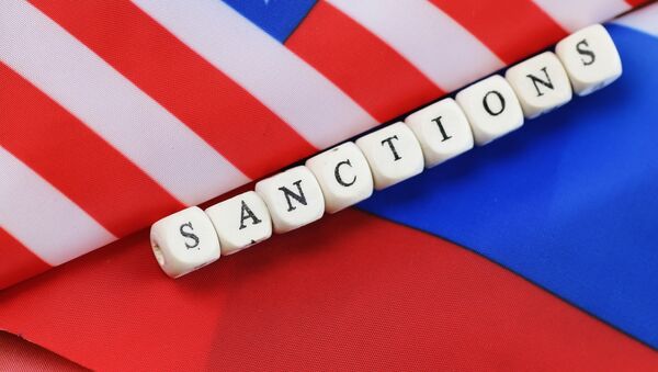 Надпись санкции, сложенная из кубиков между флагами США и России - Sputnik Аҧсны