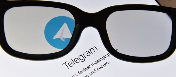 Логотип мессенджера Telegram на экране планшета. - Sputnik Абхазия