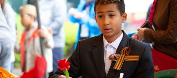 Мальчик на праздничном мероприятии в Сеуле, посвященном Дню Победы в Великой Отечественной войне 1941-1945 годов Мальчик на праздничном мероприятии в Сеуле, посвященном Дню Победы в Великой Отечественной войне 1941-1945 годов - Sputnik Абхазия