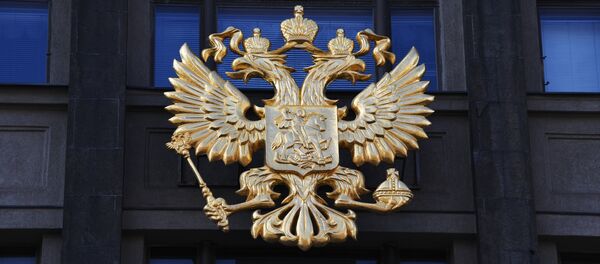 Герб на здании Государственной Думы РФ на улице Охотный ряд в Москве. Герб на здании Государственной Думы РФ на улице Охотный ряд в Москве. - Sputnik Абхазия