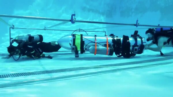 Испытания мини-субмарины, которую Американский миллионер Илон Маск предложил использовать для спасения подростков, заблокированных в пещере в Таиланде - Sputnik Абхазия