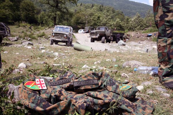 Picture taken on August 12, 2008 shows an abandoned Georgian uniform  on the ground in the remote Kodori Gorge of Georgia's breakaway Abkhazia region in the town of Chkhalta. Abkhaz separatist soldiers drove Georgian forces out of Chkhalta and took control of the town. The leaders of two Russian-backed rebel regions, South Ossetia and Abkhazia, ruled out talks with Georgia's leaders, accusing them of war crimes, Interfax news agency reported.             AFP PHOTO / STR / AFP PHOTO / STR - Sputnik Абхазия