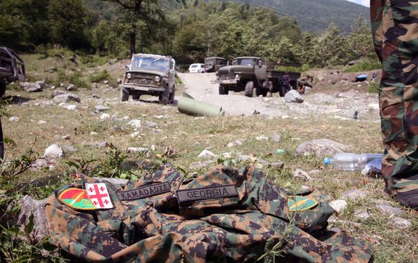 Picture taken on August 12, 2008 shows an abandoned Georgian uniform on the ground in the remote Kodori Gorge of Georgia's breakaway Abkhazia region in the town of Chkhalta. Abkhaz separatist soldiers drove Georgian forces out of Chkhalta and took control of the town. The leaders of two Russian-backed rebel regions, South Ossetia and Abkhazia, ruled out talks with Georgia's leaders, accusing them of war crimes, Interfax news agency reported. AFP PHOTO / STR / AFP PHOTO / STR Picture taken on August 12, 2008 shows an abandoned Georgian uniform on the ground in the remote Kodori Gorge of Georgia's breakaway Abkhazia region in the town of Chkhalta. Abkhaz separatist soldiers drove Georgian forces out of Chkhalta and took control of the town. The leaders of two Russian-backed rebel regions, South Ossetia and Abkhazia, ruled out talks with Georgia's leaders, accusing them of war crimes, Interfax news agency reported. AFP PHOTO / STR / AFP PHOTO / STR - Sputnik Абхазия