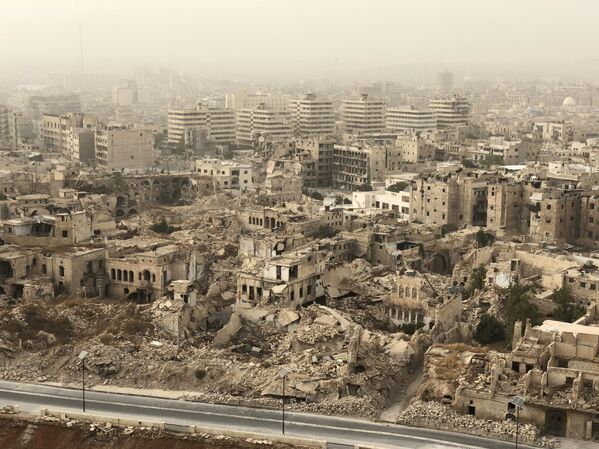 Разрушенные и поврежденные здания в Алеппо в результате военных действий - Sputnik Абхазия