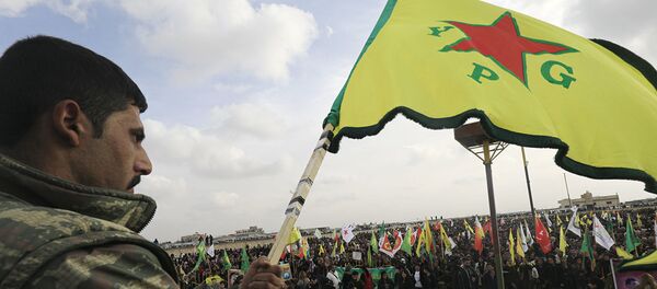 Член сил самообороны сирийских курдов (YPG) . Архивное фото Член сил самообороны сирийских курдов (YPG) . Архивное фото - Sputnik Абхазия