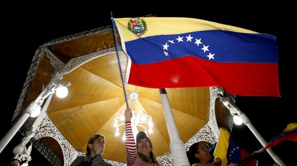 Протестующие против правительства президента Венесуэлы Николаса Мадуро в Каракасе, Венесуэла - Sputnik Абхазия