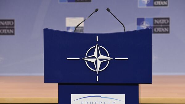 Трибуна в зале для пресс-конференций штаб-квартиры НАТО. - Sputnik Аҧсны