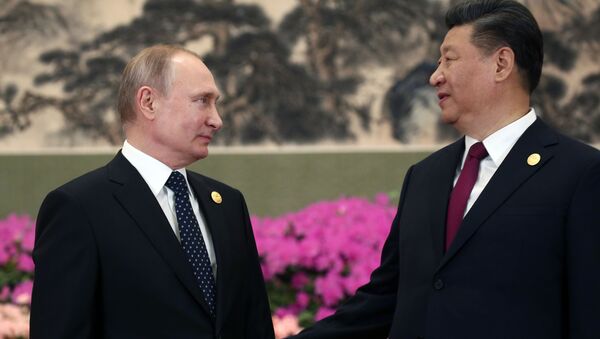 Президент РФ Владимир Путин и председатель КНР Си Цзиньпин на церемонии фотографирования глав делегаций стран-участниц второго форума международного сотрудничества Один пояс - один путь в Пекине - Sputnik Абхазия