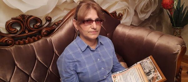 Аибашьра ду аветеран Кархалаа Хьизан Кәкә-иԥа иашьа иԥҳа Ирина Кархалааԥҳа. - Sputnik Аҧсны