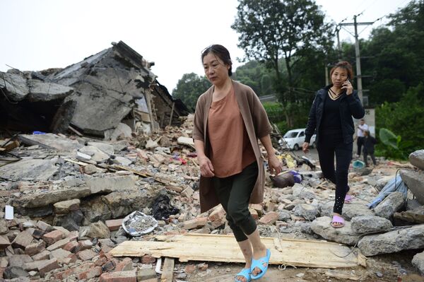 Разрушенные в результате землетрясения дома в городе Ибин, провинция Сычуань, Китай - Sputnik Абхазия