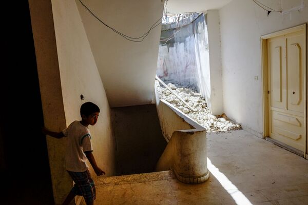 Мальчик из семьи сирийских беженцев в одном из домов в Хальбе, Ливан - Sputnik Абхазия