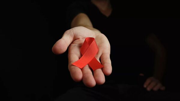 Красная лента - символ борьбы со СПИДом - Sputnik Абхазия
