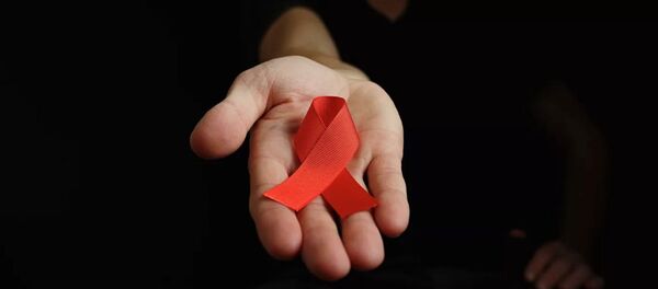 Красная лента - символ борьбы со СПИДом - Sputnik Абхазия