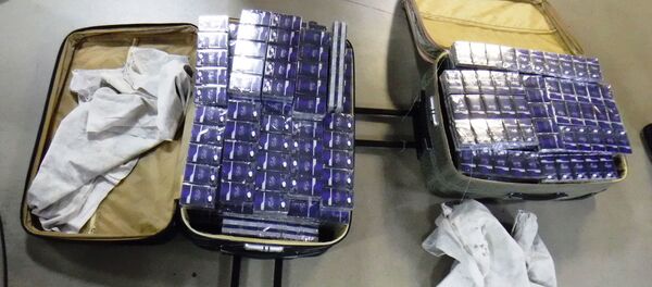 120 блоков табачных изделий без акцизных марок (1200 пачек, 24 000 штук).   120 блоков табачных изделий без акцизных марок (1200 пачек, 24 000 штук).   - Sputnik Абхазия