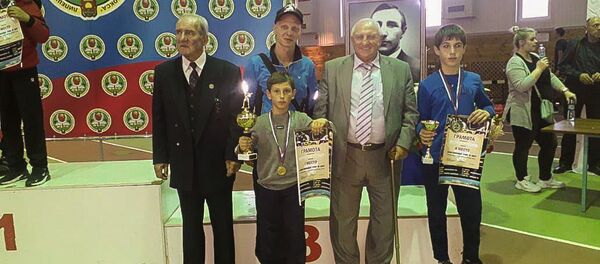 Рамин Кокория и Ринат Бения с наградами  - Sputnik Аҧсны