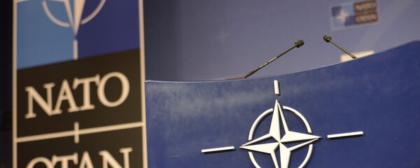 Трибуна в зале для пресс-конференций штаб-квартиры НАТО. Трибуна в зале для пресс-конференций штаб-квартиры НАТО. - Sputnik Абхазия