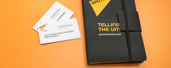 Ежедневник и визитки на столе пресс-центра Sputnik Эстония. Архивное фото Ежедневник и визитки на столе пресс-центра Sputnik Эстония. Архивное фото - Sputnik Абхазия