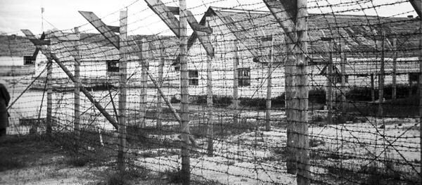 Карельский фронт. Финский концентрационный лагерь в городе Медвежьегорске. Всего на территории оккупированной Карелии действовало более десяти финских концентрационных лагерей. За годы оккупации через них прошло около 30 тысяч человек мирного населения, в основном, русских. Карельский фронт. Финский концентрационный лагерь в городе Медвежьегорске. Всего на территории оккупированной Карелии действовало более десяти финских концентрационных лагерей. За годы оккупации через них прошло около 30 тысяч человек мирного населения, в основном, русских. - Sputnik Аҧсны